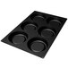 A black silicone baking mold with six square holes.