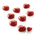 A group of red heart-shaped chocolate pieces in a Silikomart MICRO LOVE5 silicone mold.