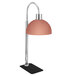 An Eastern Tabletop freestanding umbrella heat lamp with a copper finish.