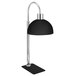 An Eastern Tabletop black freestanding heat lamp with a silver pole.