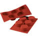 A red Silikomart silicone baking mold with 5 big muffin cavities.