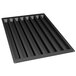 A black silicone baking mold with eight rectangular cavities.