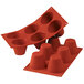 A red Silikomart silicone baking mold with six big muffin cavities.