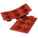 A red Silikomart silicone baking mold with six medium muffin cavities.