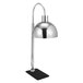 An Eastern Tabletop stainless steel freestanding heat lamp with a round metal shade.