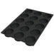 A black silicone baking mold with 15 square holes.