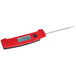 A red Taylor digital thermometer with a black screen and handle.