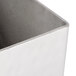 An American Metalcraft hammered stainless steel rectangular sugar caddy on a counter.