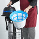 A man in an apron holds a Lavex stainless steel wet/dry vacuum filter.