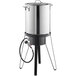 A Backyard Pro stainless steel brewing pot on a stand with a hose attached.