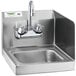 A Regency stainless steel wall mounted hand sink with a gooseneck faucet.