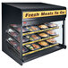 A Hatco Flav-R-Savor heated countertop food display case with trays of food inside.