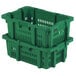 Two green Orbis agricultural vented plastic crates stacked with handles.