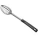 A Vollrath stainless steel slotted basting spoon with a black handle.
