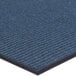 A blue Lavex Needle Rib indoor entrance mat with a black border.