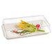 A Solia transparent PET lid on a glass container with vegetables inside.