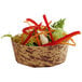 A Solia bamboo leaf mini dish filled with salad and vegetables.