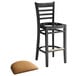 A Lancaster Table & Seating black wood ladder back bar stool with a light brown vinyl seat cushion.