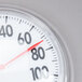 A close up of a Taylor 5630 Dial Thermometer with a red line on it.