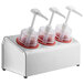 A Steril-Sil stainless steel 3-compartment condiment dispenser with red cylinders and dome top pump lids.