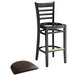 A Lancaster Table & Seating black wood ladder back bar stool with dark brown vinyl seat on a white background.