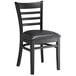 A Lancaster Table & Seating black wood ladder back chair with a black vinyl seat