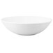 A white Chef & Sommelier china bowl with a rolled edge.