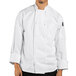 A man wearing a white Uncommon Chef long sleeve chef coat with a knot button.