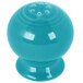 A turquoise Fiesta pepper shaker with holes.