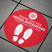 A red E-Z Up circle floor decal with white text reading "Thank you for social distancing"