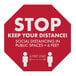 A red E-Z Up octagon floor decal with white text reading "Stop Your Distance"