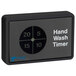 A black rectangular Antunes hand wash timer with a circular black circle with white numbers.