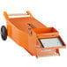 An orange cart with wheels and a handle for Fryclone 70 - 100 lb. fryer oil shuttle.