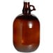 An Acopa amber glass growler with a handle and black lid.