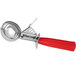 A metal ice cream scoop with a red handle.