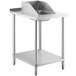 A Regency stainless steel filler table with a drop-in sink on a metal stand.