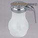 A white plastic Tablecraft teardrop syrup dispenser with a chrome lid and handle.