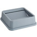A Lavex gray plastic container with a swing lid.