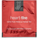 A red and white box of Wild Hibiscus Heart-Tee Hibiscus Herbal Tea Bags.