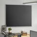 A Dynamic by 360 Office Furniture black wall-mount magnetic chalkboard with aluminum frame.