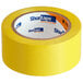 A roll of Shurtape yellow line set tape.