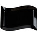 A black rectangular plate with a curved edge.