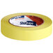A roll of yellow Shurtape general masking tape.