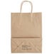 A brown Sabert paper bag with black text and handles.