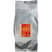 A silver bag of Bossen Dark Roast Oolong Loose Leaf Tea with a label.