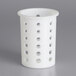 A white plastic flatware cylinder with holes in it.