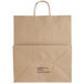 A brown Kraft paper bag with a handle and black text.