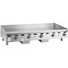 A large stainless steel Wolf gas countertop griddle with manual controls.