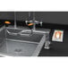 A Guardian Equipment right hand deck mounted eyewash station with a faucet and swivel nozzle.