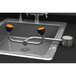 A Guardian Equipment stainless steel deck mounted eyewash station with black and orange handles.